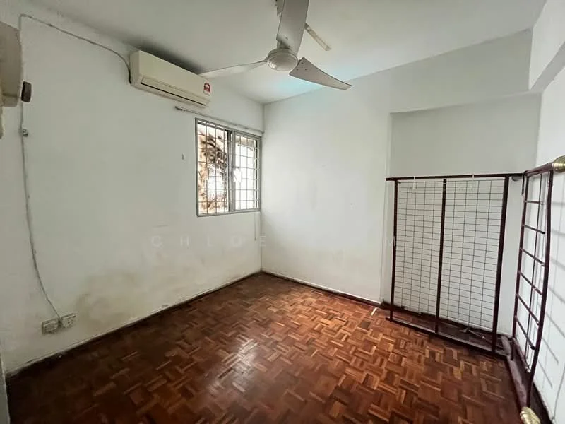 Room features: parquet wood flooring, white painted walls, 1 wall-mounted split AC, ceiling fan, window with metal grille, corner floor lamp, built-in wardrobe frame.