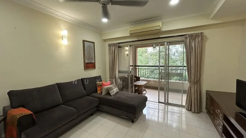 Living features: L-shape sectional sofa in dark grey, coffee table, wall-mounted TV, ceiling fan, white painted walls, tile flooring, large sliding glass door, curtains, decorative artwork on wall, air conditioning unit; style: modern; view: garden.