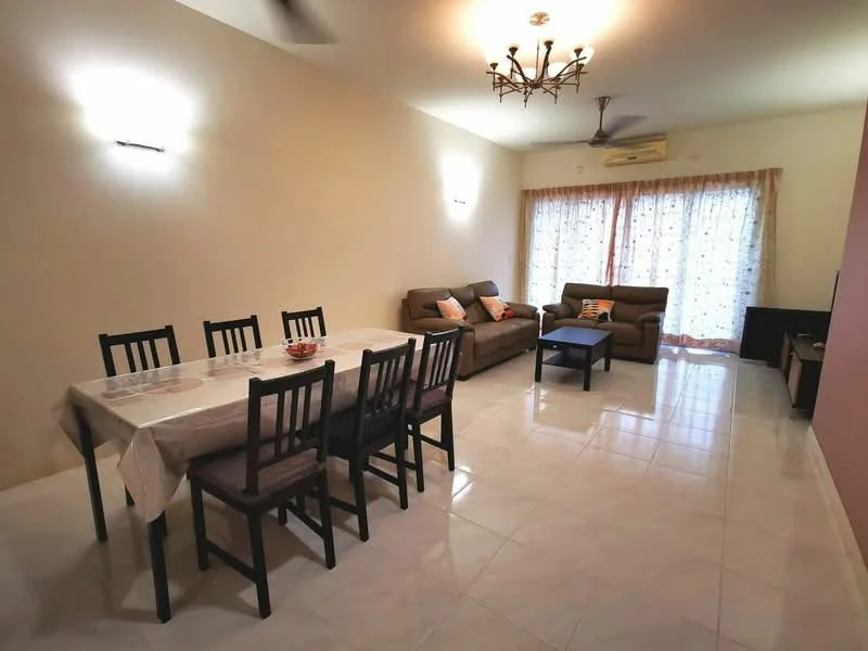 Living features: cream painted walls, white ceiling, 5-blade ceiling fan with light, floor-to-ceiling windows, sheer curtains, light-colored tiled flooring, 2-seater fabric sofa in brown, 3-seater fabric sofa in brown, coffee table, dining table for 6 with chairs, decorative cushions on sofas, TV console; style: modern.
