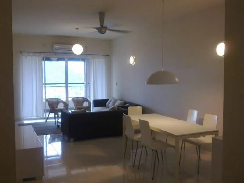 Living features: 3-seater fabric sofa in dark color, coffee table, area rug, floor-to-ceiling windows, sheer curtains, ceiling fan, pendant lighting, wall-mounted air conditioning unit; style: modern; view: city. Dining features: 6-seater dining table, white dining chairs, pendant lamp, open layout, marble flooring; style: modern; view: city.