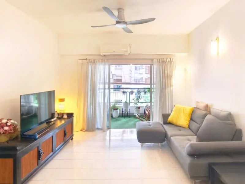 Living features: grey fabric sofa, yellow decorative pillow, wooden TV console, wall-mounted flat-screen TV, 5-blade ceiling fan, white painted walls, sliding glass door, floor-to-ceiling windows, sheer curtains, tile flooring, decorative lamp, indoor plants, green outdoor view; style: modern; view: garden.