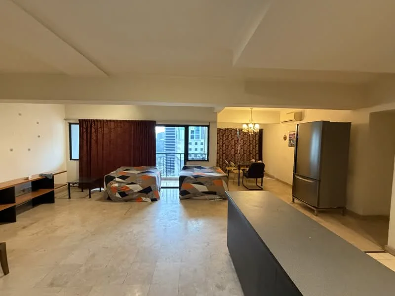 Living features: marble flooring, white painted walls, tray ceiling, floor-to-ceiling windows, curtains in dark red, curtains with geometric pattern, refrigerator, dining table, two beds with patterned bedspreads, sofa, light fixture with multiple bulbs; style: modern; view: city.