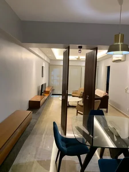 Living features: light grey painted walls, marble flooring, recessed downlights, ceiling fan, wall-mounted TV, wooden TV console, glass dining table with blue chairs, partition with wooden panels, sofa set in beige, large windows with sheer curtains; style: modern.
