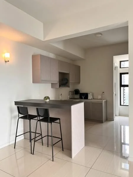 Kitchen features: light grey cabinetry, black countertop, stainless-steel appliances, built-in microwave, coffee machine, kettle, bar stools, pendant lighting, white walls, glossy tile flooring, open layout, window with natural light; style: modern.