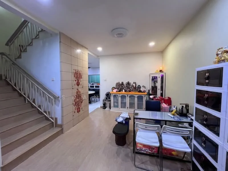 Living features: light wood flooring, cream painted walls, decorative wall with red floral pattern, dining table with white chairs, black storage cabinet, kettle, toaster, decorative items on display, staircase leading to upper floor, recessed ceiling lights; style: modern. Room features: open layout, light wood flooring, cream painted walls, recessed ceiling lights.