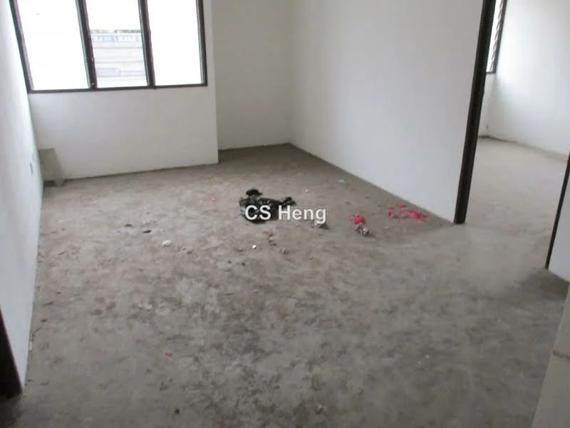 Room features: bare concrete flooring, white painted walls, two windows, no visible furniture, scattered debris on floor.