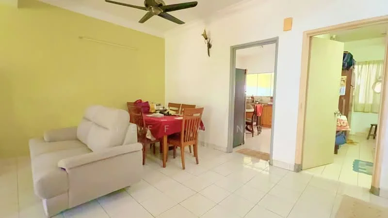 Living features: beige fabric sofa, 4-seater dining table, wooden dining chairs, green accent wall, white painted walls, tile flooring, ceiling fan, window with sheer curtains; style: modern. Kitchen features: wood cabinetry, countertop, kitchen appliances visible, window with natural light.