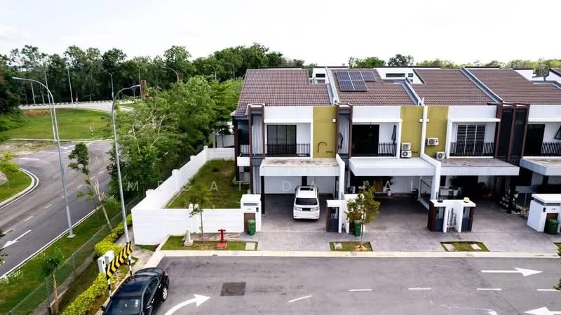 Exterior type: linked terrace house; features: two-storey linked terrace, white painted facade, green accent wall, flat roof, solar panels on roof, driveway with interlocking pavers, covered car porch, manicured landscaping, mature trees, street view, surrounded by greenery; style: modern.