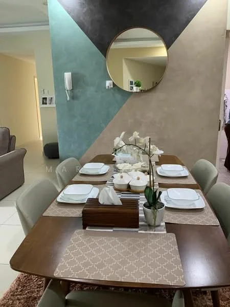 Dining features: wood dining table, 6 upholstered dining chairs, table placemats, decorative vase with white orchids, round mirror on wall, light grey accent wall, green accent wall, beige wall, white plates, tissue box, cutlery, table runner; style: modern. Living features: beige fabric sofa, light grey walls, decorative items on shelves; style: modern.