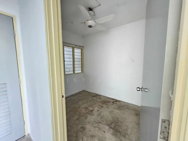 Room features: white painted walls, concrete flooring, ceiling fan, window with horizontal slats, door with knob, light fixture on ceiling.