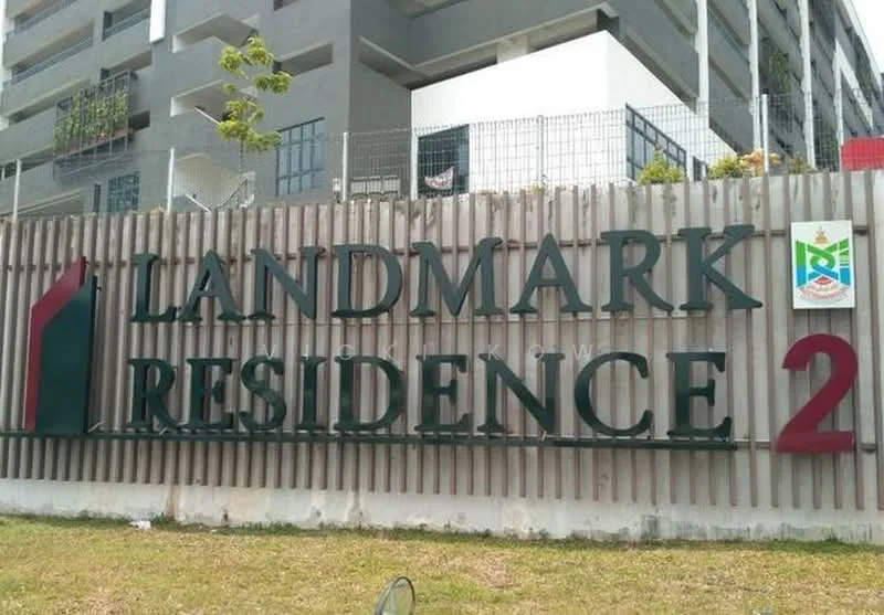Exterior features: signage with 'LANDMARK RESIDENCE 2', metal fence, landscaped grass area, modern architectural design, multi-storey building in background; style: modern.