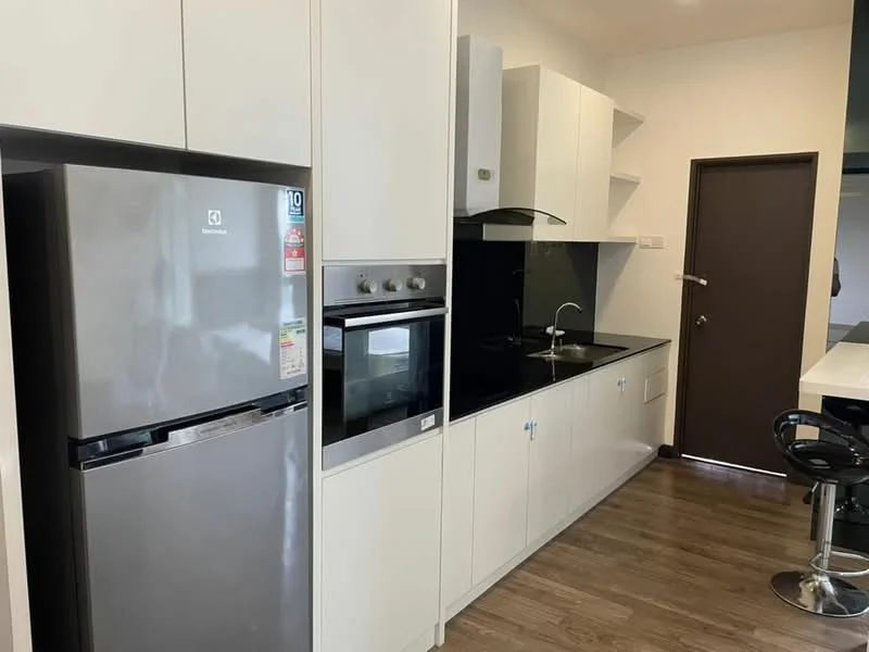 Kitchen features: white cabinetry, black countertop, stainless-steel fridge, built-in oven, built-in microwave, single-bowl stainless-steel sink, chrome pull-down faucet, open shelving, wood laminate flooring, black backsplash, bar stools at counter; style: modern.