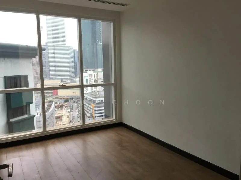 Room features: large floor-to-ceiling windows, city skyline view, light wood flooring, white painted walls, black baseboards, minimalist design; style: modern; view: city.