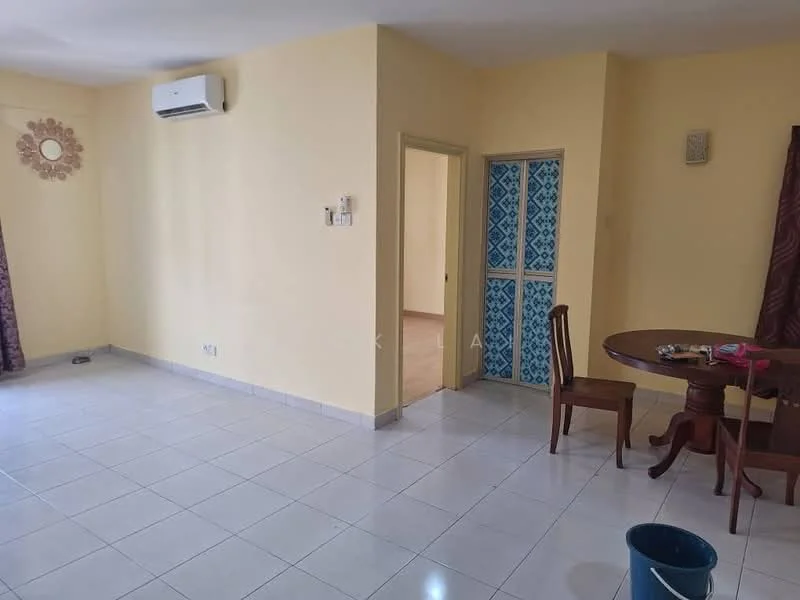 Living features: cream painted walls, white tiled flooring, 1 wall-mounted split AC, round wooden dining table, 2 wooden chairs, curtains in burgundy, decorative wall mirror, doorway leading to another room, blue patterned door, bucket on the floor.