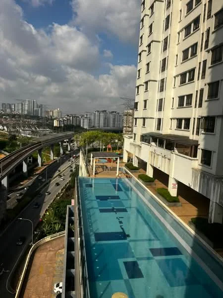 Exterior type: high-rise condominium; features: infinity pool, pool deck with loungers, surrounding greenery, city skyline view, multiple storeys, balconies on upper floors, glass railing, landscaped garden area, nearby elevated train tracks, urban context with roads; style: modern.