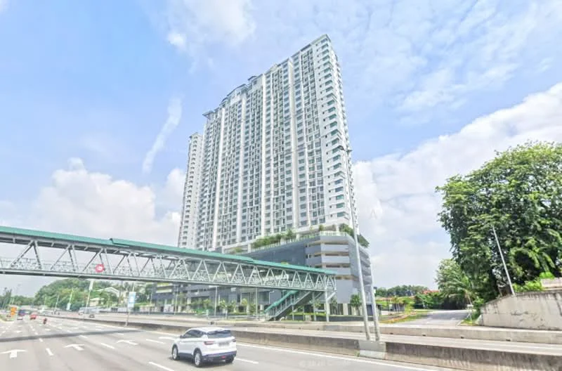 Exterior type: high-rise condominium; features: glass curtain wall, white painted facade, recessed balconies, greenery on terraces, multi-storey structure, surrounded by mature greenery, adjacent to highway, elevated walkway, parking deck visible; style: modern.
