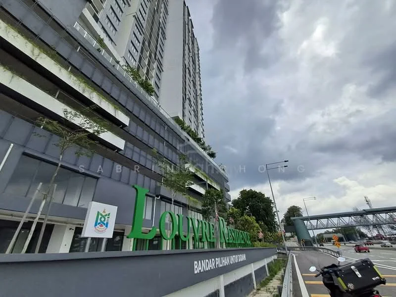 Exterior type: high-rise condominium; features: grey concrete facade, glass balcony railings, green landscaping on balconies, signage with 'Louvre Residence', multiple storeys, surrounding road access, urban context with nearby road, cloudy sky; style: modern.