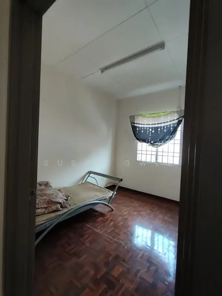 Bedroom features: wooden flooring, white painted walls, single bed with mattress, window with sheer curtains, ceiling light fixture, bed linens on bed, decorative wall hanging, corner of room visible.