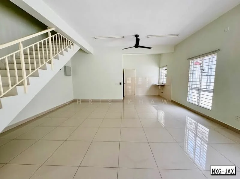 Living features: cream painted walls, white ceiling, 5-blade ceiling fan, large windows with horizontal bars, glossy beige floor tiles, open layout, staircase with white railing, kitchenette area visible, wall-mounted electrical outlets, natural light from windows; style: modern.