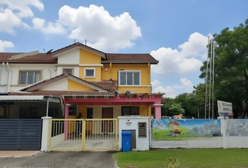 Exterior type: linked terrace house; features: yellow and pink painted facade, double-storey, pitched tile roof, front porch with gate, manicured lawn, driveway with interlocking pavers, visible signage on wall, surrounded by greenery; style: modern.