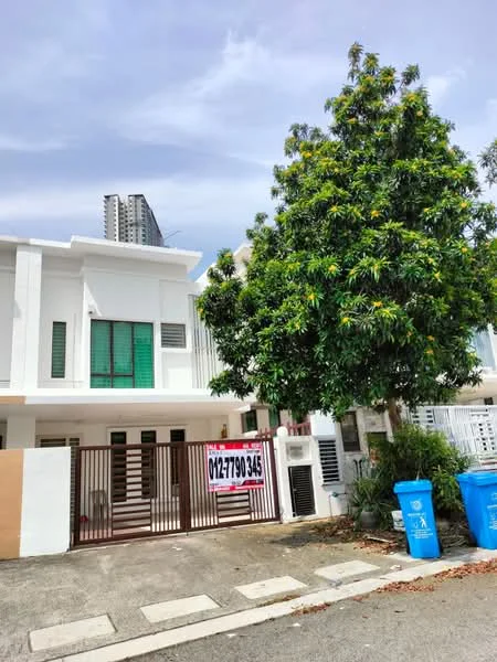Exterior type: linked terrace house; features: white painted facade, green window shutters, gated entrance, manicured landscaping, mature tree in front yard, paved driveway, two blue trash bins, surrounding residential area, adjacent high-rise building; style: modern.