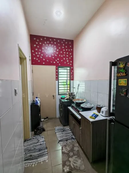Kitchen features: red accent wall with floral pattern, white tiled walls, grey laminate cabinetry, stainless-steel fridge, black countertop, double-bowl sink, chrome pull-down faucet, built-in washing machine, tile flooring, window with metal grille, area rug with geometric pattern, kitchen utensils on countertop; style: modern.
