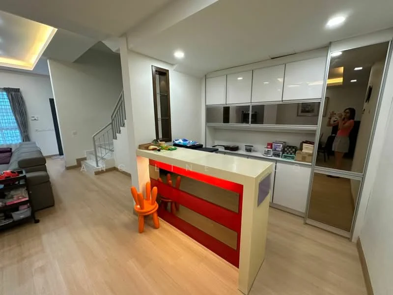 Kitchen features: white cabinetry with glossy finish, red accent panel on kitchen island, countertop with smooth surface, built-in oven, stainless-steel sink, chrome faucet, open shelving, recessed downlights, wooden flooring, wall-mounted mirror, kitchen island with seating, decorative items on countertop, small orange chair; style: modern.