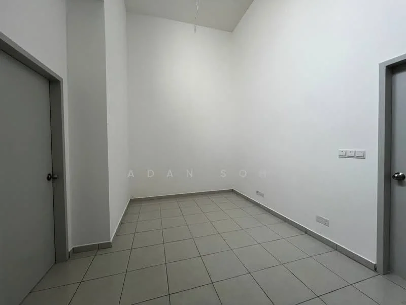 Room features: white painted walls, grey tiled flooring, high ceiling, single door, light switch, power outlet.
