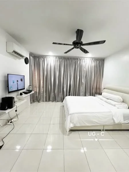 Bedroom features: white painted walls, glossy white tile flooring, 5-blade ceiling fan with light, wall-mounted TV, white upholstered bed frame, white bedding, sheer curtains, black TV console, air conditioning unit; style: modern.
