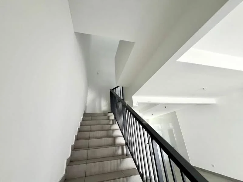 Room features: white painted walls, staircase with grey tile flooring, black metal railing, recessed ceiling lights, open space, natural light from upper level; style: modern.