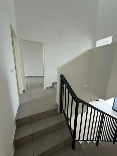 Room features: staircase with black metal railing, grey tiled flooring, white painted walls, natural light from windows, open layout, landing area, doorway to adjacent room; style: modern.