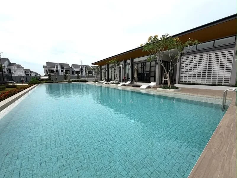 Exterior type: clubhouse; features: infinity pool, pool deck with loungers, landscaped garden, manicured lawn, trees surrounding the pool area, modern architectural design, large glass windows, outdoor seating area; style: modern.