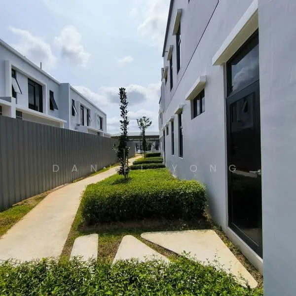 Exterior type: linked terrace house; features: grey painted facade, manicured lawn, landscaped garden with shrubs, paved walkway, two-storey building, windows with black frames, outdoor pathway, surrounding greenery; style: modern.