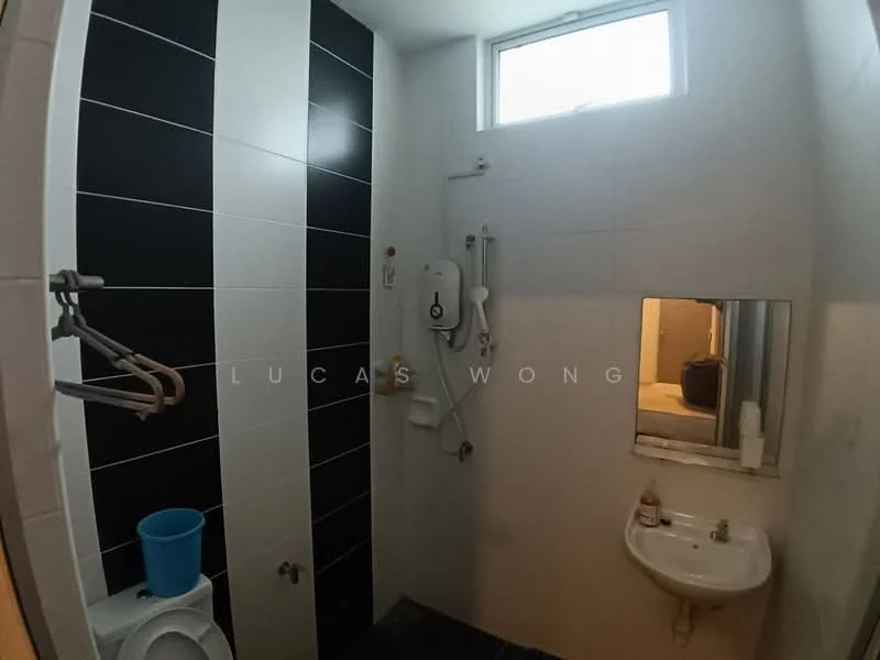 Bathroom features: black and white tiled walls, white ceramic floor tiles, shower area with wall-mounted showerhead, toilet, small white sink, mirror above sink, towel rack, window for natural light; style: modern.