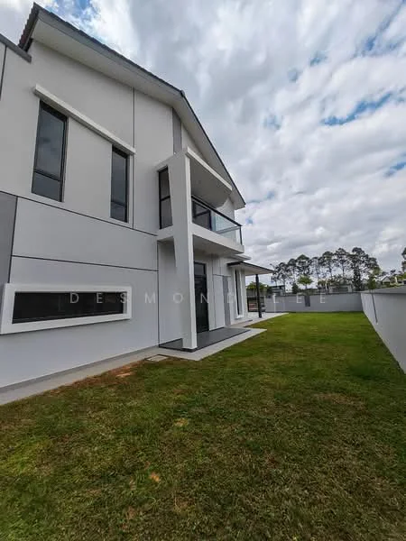 Exterior type: detached bungalow; features: white painted facade, flat roof, large windows, balcony with glass railing, manicured lawn, concrete pathway, surrounded by greenery; style: modern.