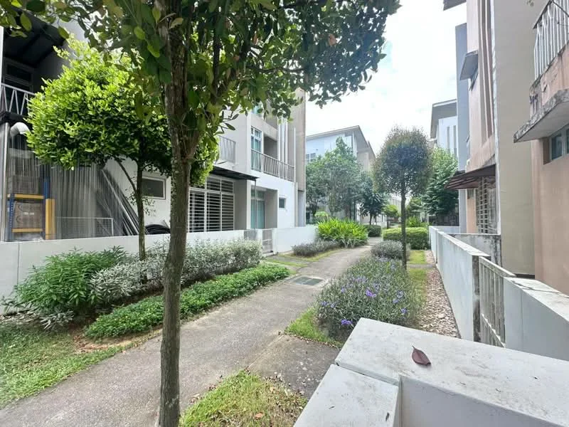 Exterior type: linked terrace house; features: manicured lawn, mature trees, tropical landscaping, stone-paved walkway, surrounded by greenery, two-storey buildings, garden beds with shrubs, pathway leading through the garden; style: modern.