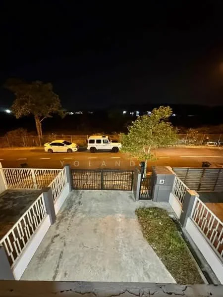 Exterior type: linked terrace house; features: concrete driveway, manicured lawn, fenced perimeter, street view, night lighting, two parked cars visible, paved walkway, front gate; style: modern.
