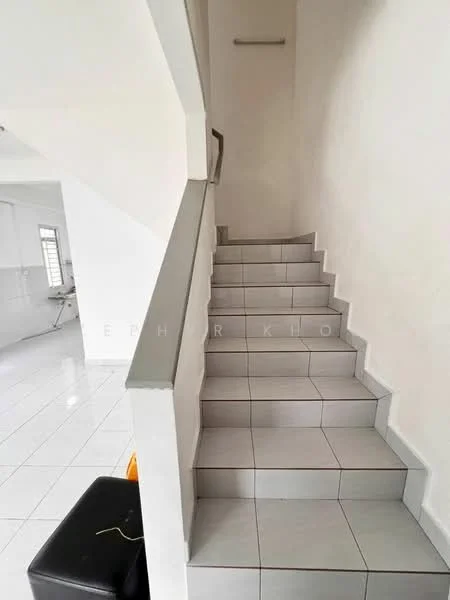 Room features: white painted walls, grey tiled flooring, staircase with tiled steps, handrail, natural light from window, open layout, minimalist decor; style: modern.
