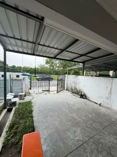 Exterior type: car porch; features: metal roof, concrete flooring, open-air space, gate, surrounding wall, landscaped area with grass, driveway access; style: modern.