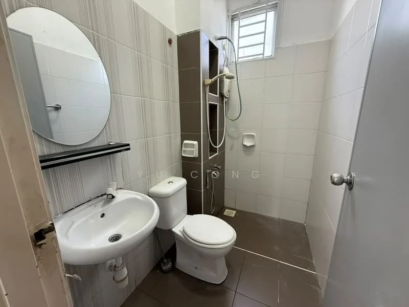 Bathroom features: white tiled walls, brown accent wall, ceramic tile flooring, round mirror, single-sink vanity, chrome basin mixer faucet, one-piece toilet, shower with handheld showerhead, wall-mounted shower holder, window for natural light; style: modern.