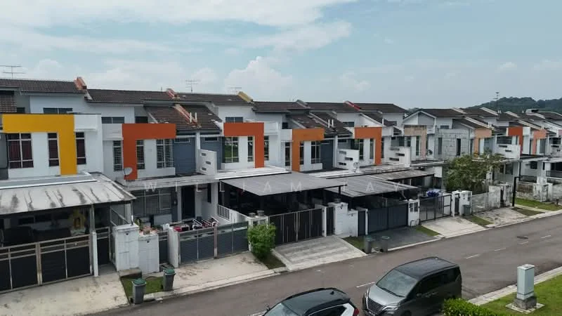 Exterior type: linked terrace house; features: two-storey linked terrace houses, white painted facade, orange and yellow accent colors on balconies, flat roof, manicured lawn in front, driveway with interlocking pavers, visible car parking, surrounded by greenery, quiet residential street, fenced perimeter; style: modern.