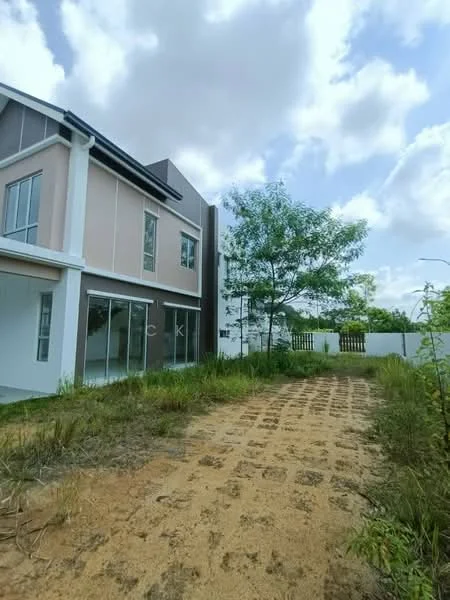 Exterior type: semi-detached house; features: two-storey building, light pink painted facade, large windows, manicured lawn, gravel pathway, surrounding greenery, fence in background, clear blue sky; style: modern.