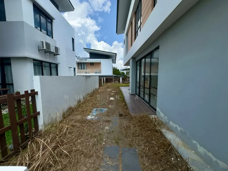 Exterior type: semi-detached house; features: white painted facade, brown wooden accents, flat roof, approximately 2-storey, manicured lawn area, paved walkway, fenced yard, air conditioning unit visible; style: modern.