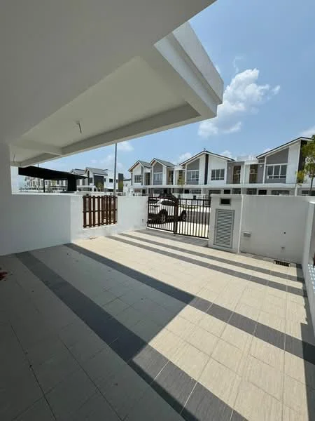Exterior type: linked terrace house; features: white painted facade, flat roof, manicured lawn, paved walkway, gated entrance, surrounded by residential houses, driveway with interlocking pavers; style: modern.