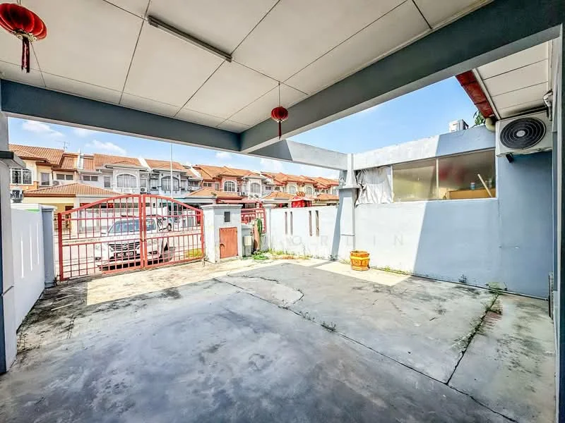 Exterior type: linked terrace house; features: concrete flooring, red metal gate, white painted walls, overhead ceiling with tiles, visible air conditioning unit, open outdoor space, surrounded by residential buildings, sunny outdoor area; style: modern.