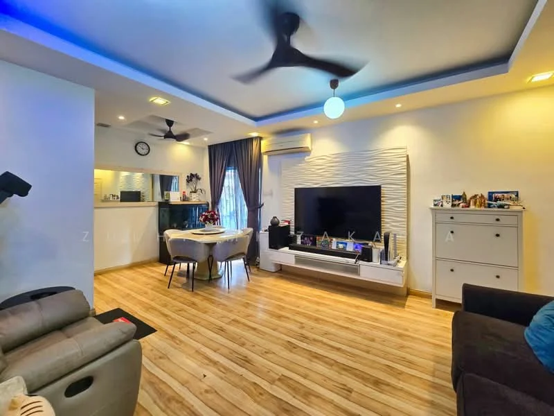 Living features: wooden flooring, recessed ceiling with LED lighting, 5-blade ceiling fan, wall-mounted TV, white entertainment unit, decorative wall panel, large window with curtains, sofa, coffee table, decorative items on shelves; style: modern. Kitchen features: open kitchen layout, white cabinetry, black countertop, stainless-steel sink, built-in oven, stove, kitchen island with seating, wall clock; style: modern.