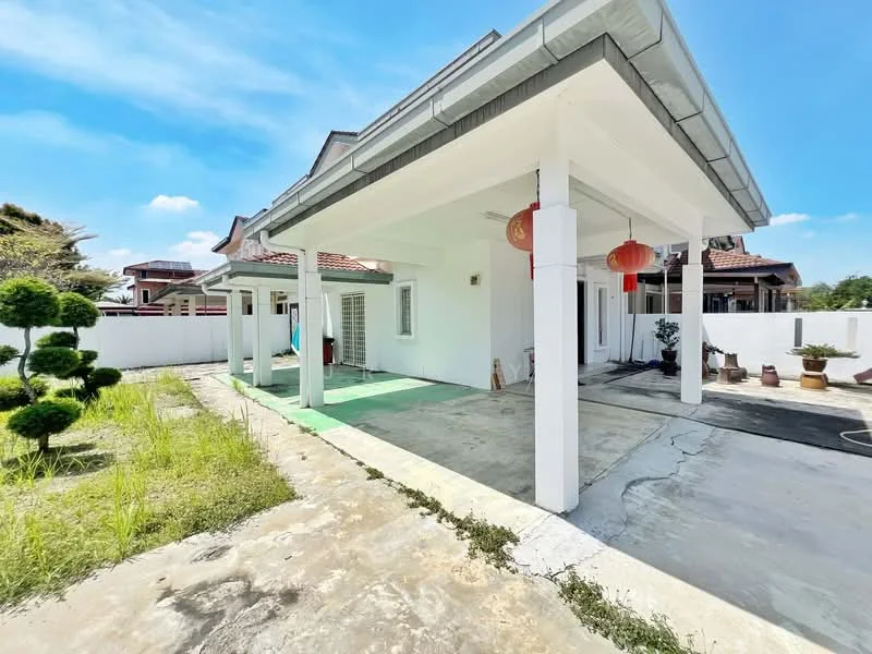 Exterior type: detached bungalow; features: white painted facade, flat roof, concrete flooring, manicured lawn, landscaped garden with topiary, outdoor space with green area, decorative lanterns, surrounded by white fencing; style: modern.