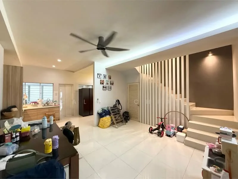 Room features: white painted walls, light-colored wood cabinetry, stainless-steel refrigerator, ceiling fan, white tile flooring, staircase with wooden railing, decorative wall with photo frames, storage boxes, children's tricycle, open layout, natural light from windows; style: modern.