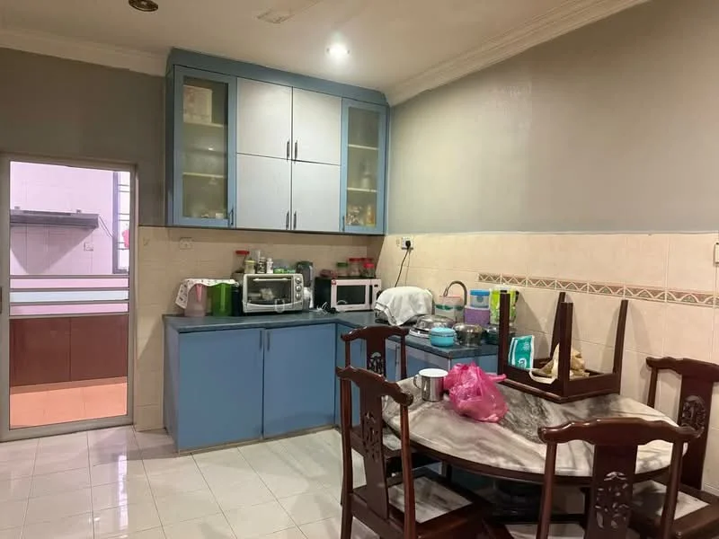 Kitchen features: blue cabinetry with glass-front upper cabinets, grey countertop, white tiled backsplash, microwave, toaster, kettle, stainless-steel sink, dining table with marble top, wooden dining chairs, white tiled flooring, recessed ceiling lights, wall-mounted shelves; style: modern.