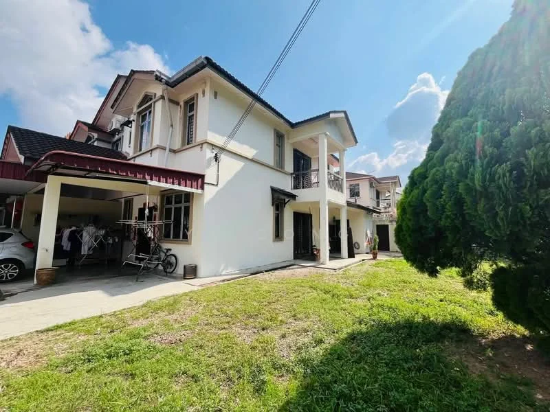 Exterior type: semi-detached house; features: white painted facade, flat roof, two-storey, manicured lawn, paved walkway, car porch, surrounded by greenery, windows with black grills, balcony on upper floor, visible outdoor area; style: modern.